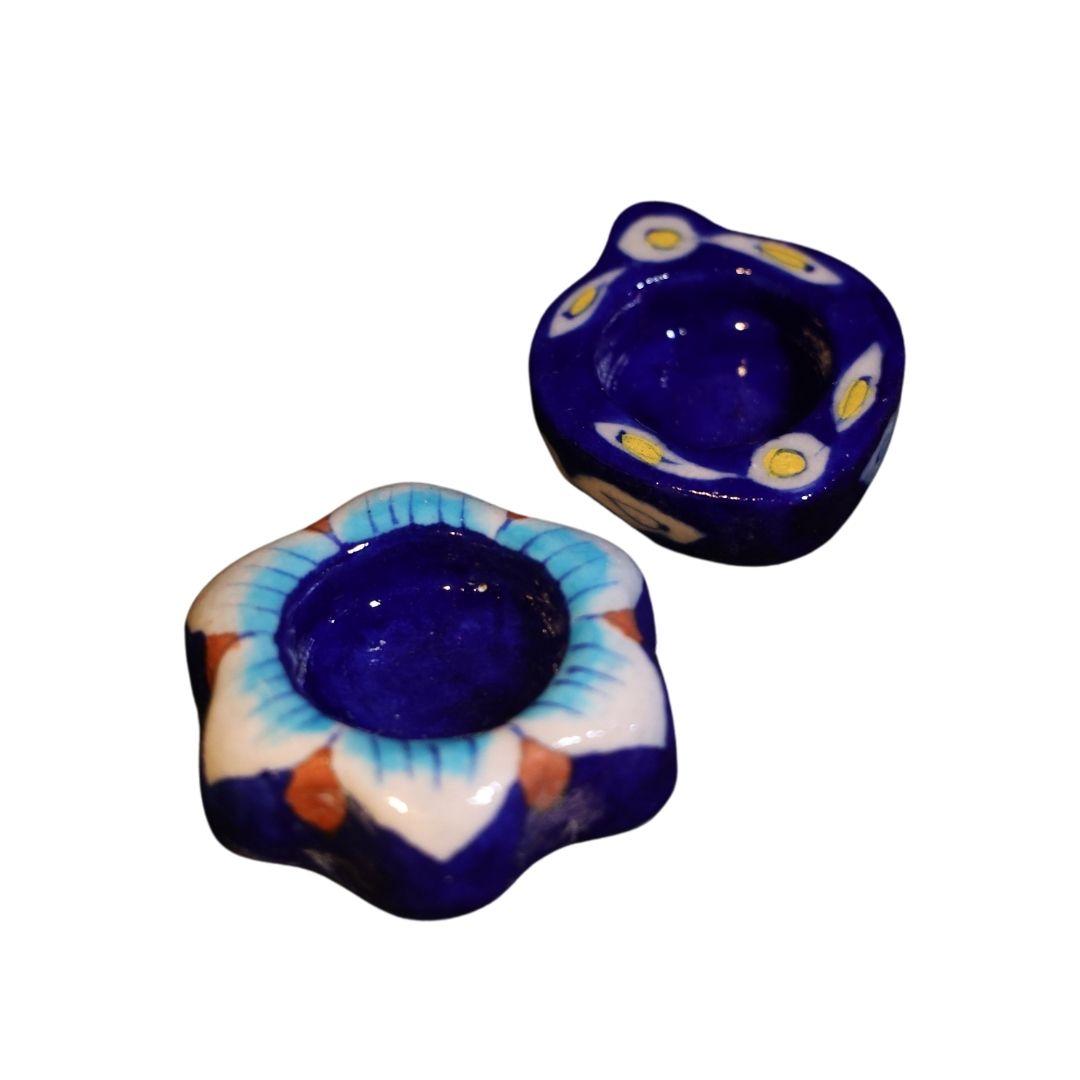 Assorted Blue pottery tea light holders in different design and shape