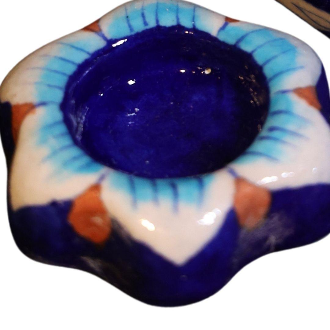 Assorted Blue pottery tea light holders in different design and shape